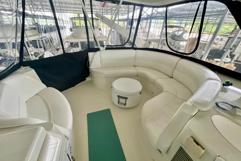 Slide: The Image of Luxurious interior of 2005 Carver 56 Voyager yacht with white seating and panoramic windows. - 33