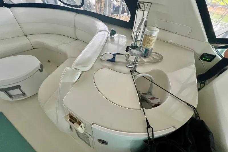 Slide: The Image of Luxurious interior of 2005 Carver 56 Voyager yacht with white seating and built-in amenities. - 34
