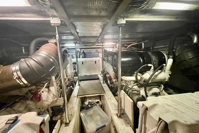 Slide: The Image of Engine room of a 2005 Carver 56 Voyager yacht, showcasing mechanical components. - 39