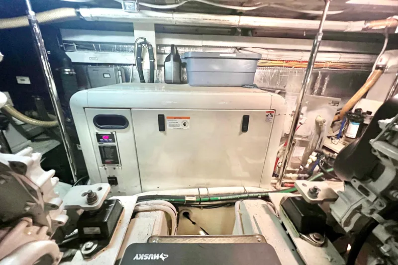 Slide: The Image of Engine room of a 2005 Carver 56 Voyager yacht, featuring machinery and equipment. - 40