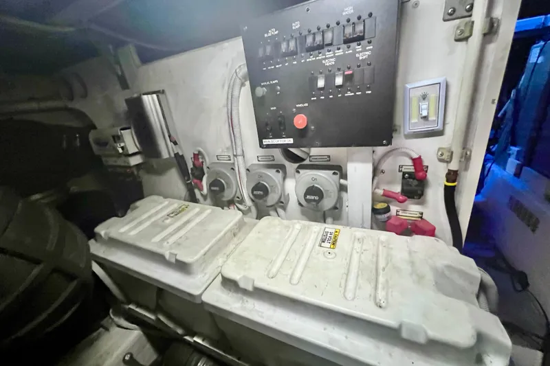 Slide: The Image of Electrical panel and battery compartment in a 2005 Carver 56 Voyager yacht. - 42