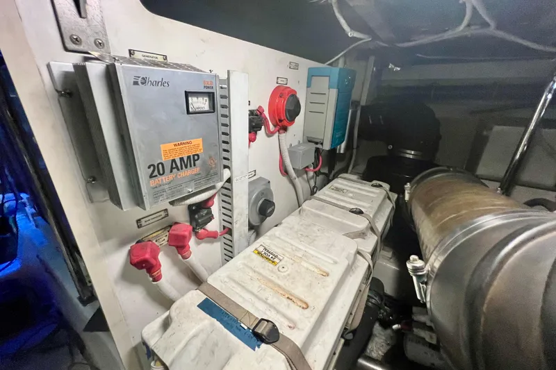 Slide: The Image of Engine room of a 2005 Carver 56 Voyager with battery charger and electrical components. - 43