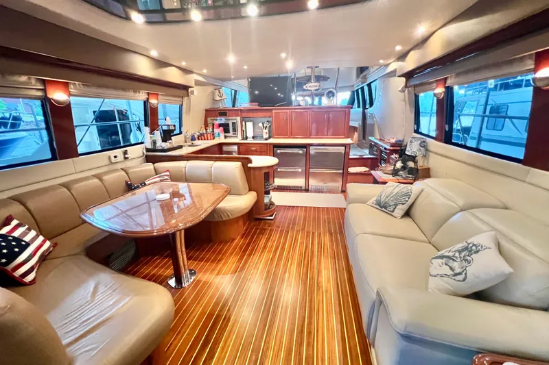 Slide: The Image of Luxurious interior of a 2005 Carver 56 Voyager yacht with elegant seating and wood flooring. - 5