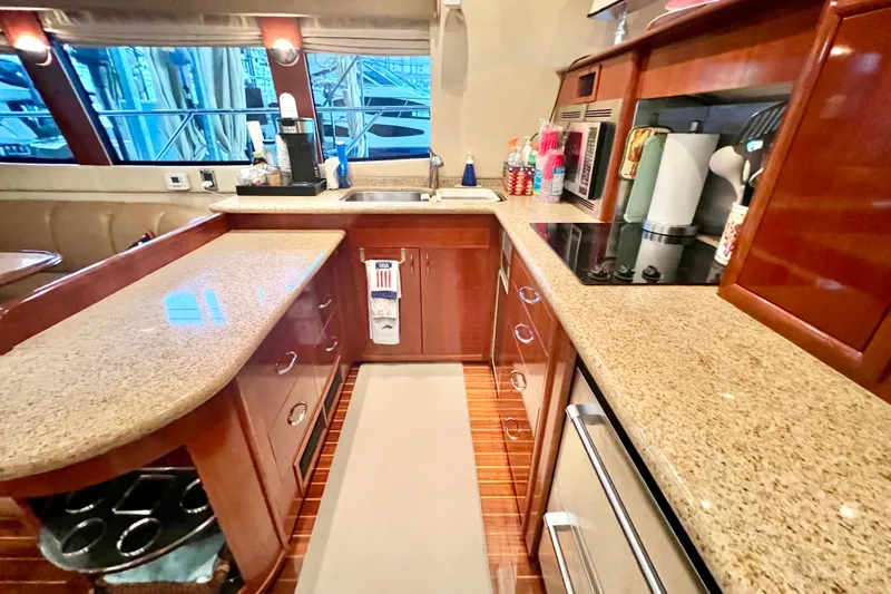 Slide: The Image of Luxurious kitchen interior of 2005 Carver 56 Voyager yacht with modern amenities. - 7