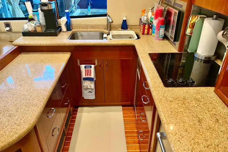 Slide: The Image of Luxurious kitchen interior of a 2005 Carver 56 Voyager yacht with modern amenities. - 8