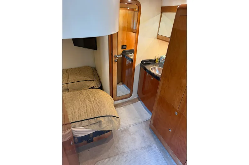Slide: The Image of Interior of 2003 Regal Commodore 4260 yacht with twin beds and compact bathroom. - 10