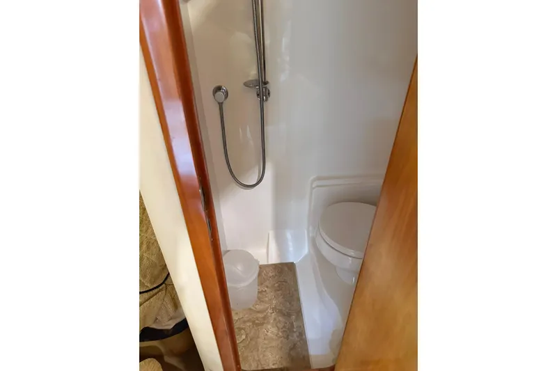 Slide: The Image of Compact bathroom in 2003 Regal Commodore 4260 yacht with shower and toilet. - 11