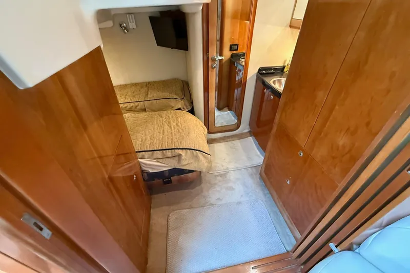 Slide: The Image of Interior of 2003 Regal Commodore 4260 yacht with cozy cabin and kitchenette. - 12