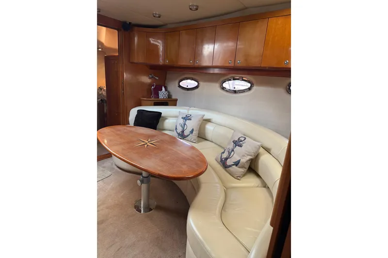 Slide: The Image of Luxurious interior of 2003 Regal Commodore 4260 yacht with elegant seating and nautical decor. - 8