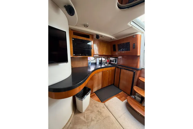 Slide: The Image of Interior of 2003 Regal Commodore 4260 yacht with modern kitchen amenities. - 9