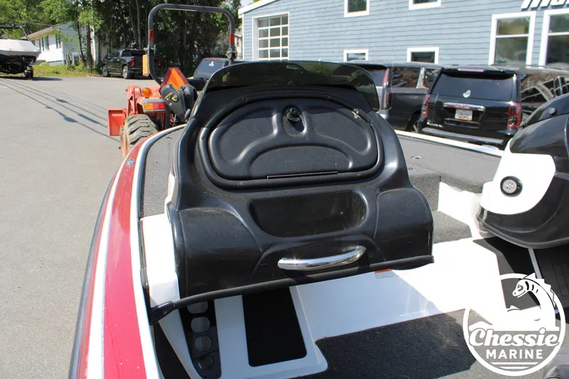 Slide: The Image of 2015 Tracker NITRO Z7 boat with storage compartment lid, parked outdoors. - 11