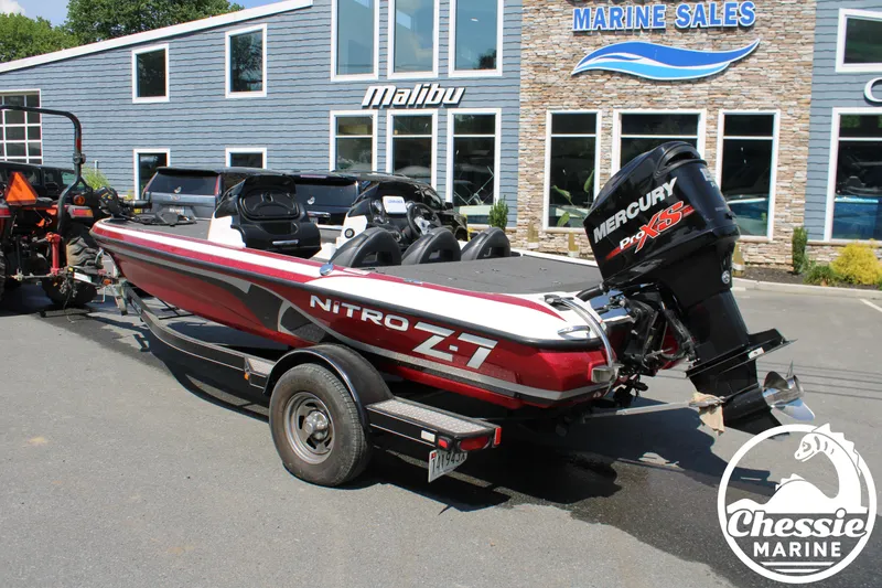 Slide: The Image of 2015 Tracker NITRO Z7 boat outside marine sales shop. - 3