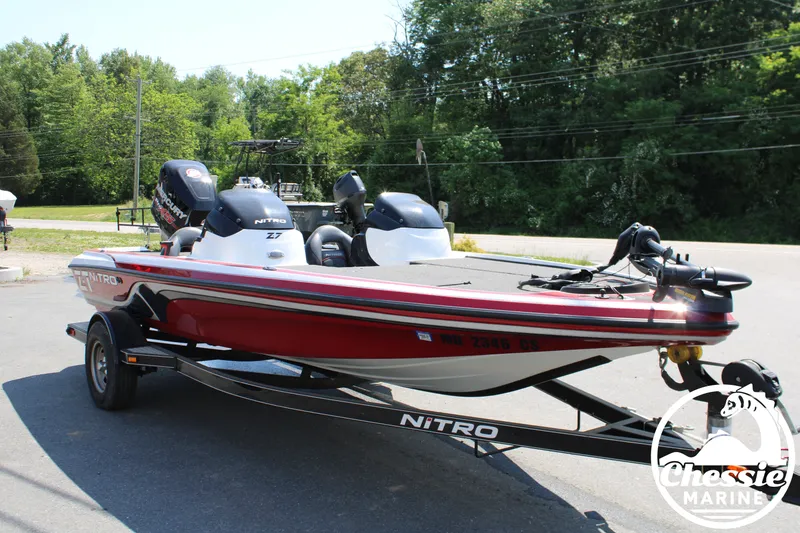 Slide: The Image of 2015 Tracker NITRO Z7 boat parked on trailer outdoors. - 7