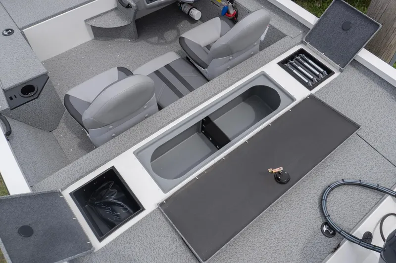 Slide: The Image of 2026 G3 Sportsman 1610 boat interior with storage compartments and seating. - 13
