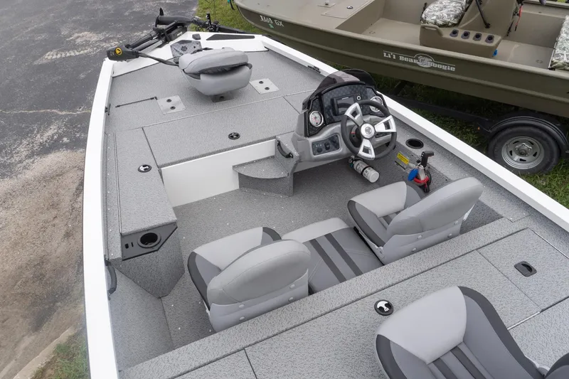 Slide: The Image of 2026 G3 Sportsman 1610 boat interior with steering console and seating. - 3