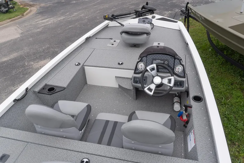 Slide: The Image of 2026 G3 Sportsman 1610 boat interior with steering wheel and seating. - 4
