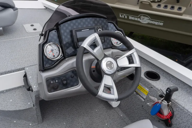 Slide: The Image of Steering console of 2026 G3 Sportsman 1610 boat with modern controls and gauges. - 5