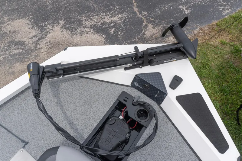 Slide: The Image of 2026 G3 Sportsman 1610 boat with Minn Kota trolling motor on deck. - 8