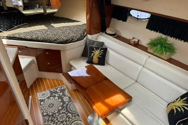Slide: The Image of Luxurious interior of 2005 Regal 3360 Window Express yacht with elegant seating and decor. - 18