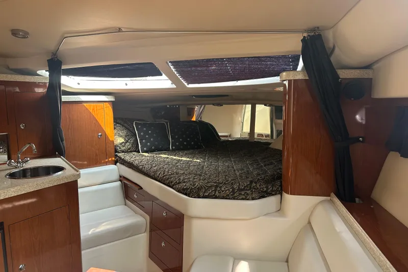 Slide: The Image of Luxurious interior of 2005 Regal 3360 Window Express yacht with cozy bed and kitchenette. - 26