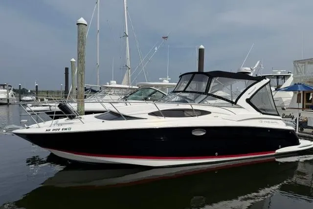 Slide: The Image of 2005 Regal 3360 Window Express boat docked at a marina. - 4