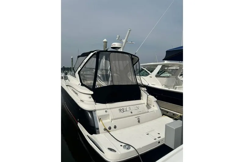 Slide: The Image of 2005 Regal 3360 Window Express boat docked at marina, rear view. - 9