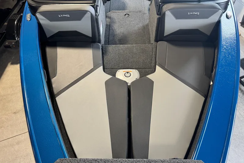 Slide: The Image of 2026 Lund 1875 Crossover XS boat interior with blue and gray seating. - 20