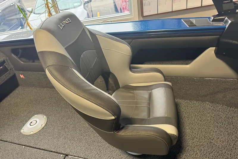 Slide: The Image of 2026 Lund 1875 Crossover XS boat seat, black and beige leather, interior view. - 3