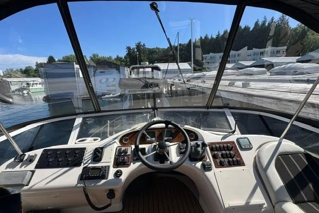 Slide: The Image of Cockpit view of 1999 Sea Ray 420 Aft Cabin yacht at marina. - 12
