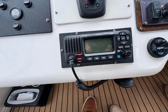 Slide: The Image of Control panel of a 1999 Sea Ray 420 Aft Cabin boat with radio and gauges. - 20