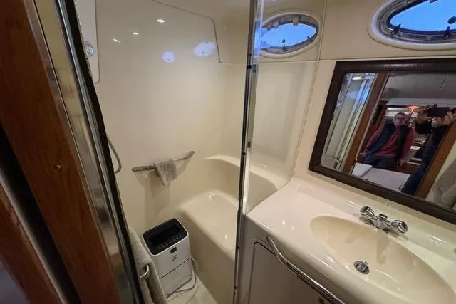 Slide: The Image of Bathroom interior of 1999 Sea Ray 420 Aft Cabin yacht with shower and sink. - 45