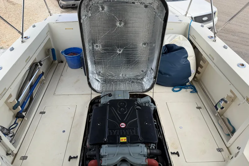 Slide: The Image of Engine compartment of a 2000 Albin 28 Tournament Express boat, open for maintenance. - 21