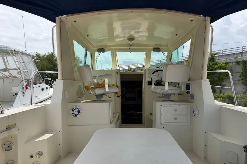 Slide: The Image of 2000 Albin 28 Tournament Express boat interior with helm and seating area. - 24