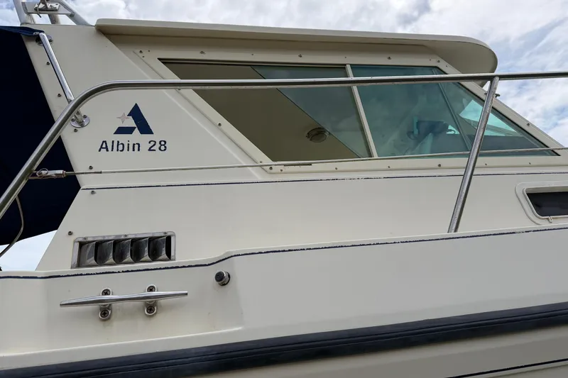 Slide: The Image of 2000 Albin 28 Tournament Express boat side view with logo and railing. - 39