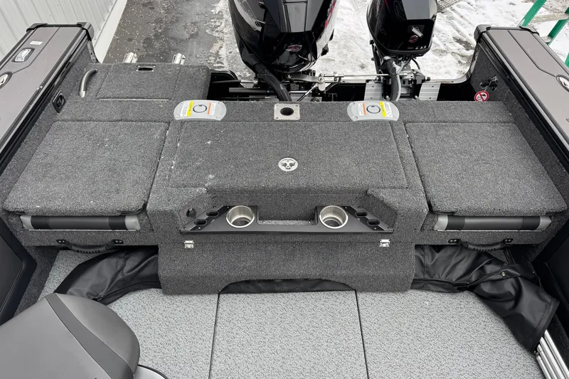 Slide: The Image of 2026 Lund 1975 Pro-V Sport boat interior with dual engines and storage compartments. - 13