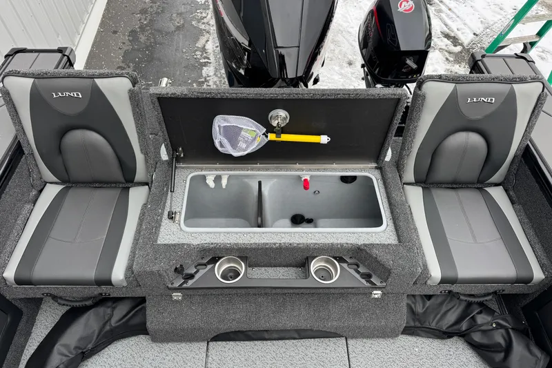 Slide: The Image of 2026 Lund 1975 Pro-V Sport boat interior with seating and storage compartments. - 14
