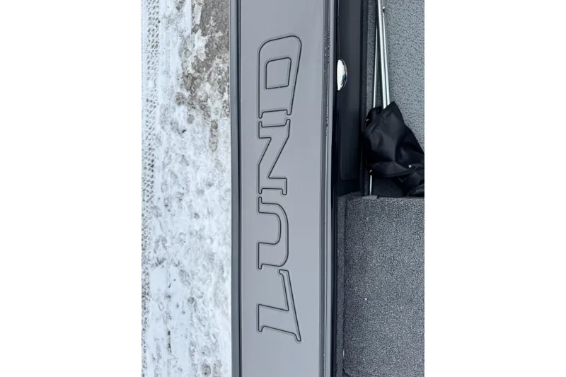 Slide: The Image of Close-up of Lund 1975 Pro-V Sport boat interior, showcasing sleek design and storage, 2026 model. - 15