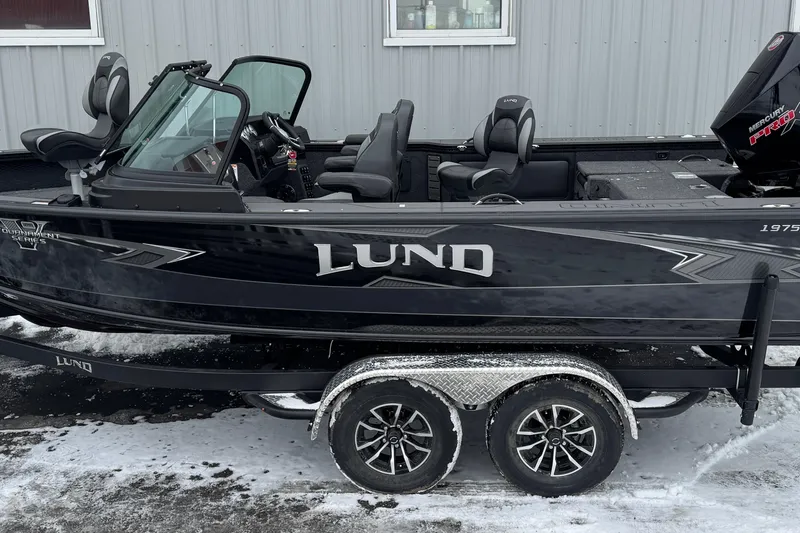 Slide: The Image of 2026 Lund 1975 Pro-V Sport boat on trailer, parked in snowy area. - 4