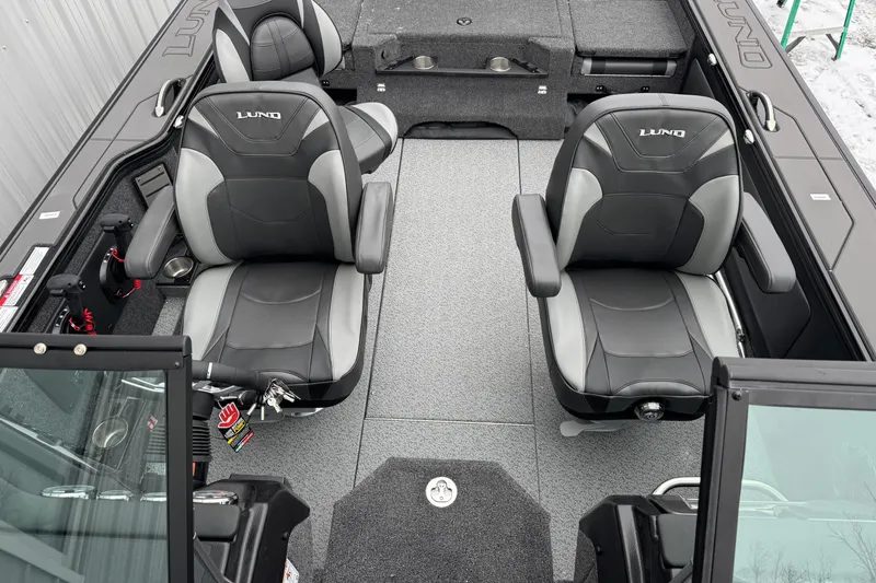 Slide: The Image of 2026 Lund 1975 Pro-V Sport boat interior with two black and gray seats. - 5