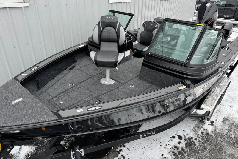 Slide: The Image of 2026 Lund 1975 Pro-V Sport fishing boat with sleek design and comfortable seating. - 9
