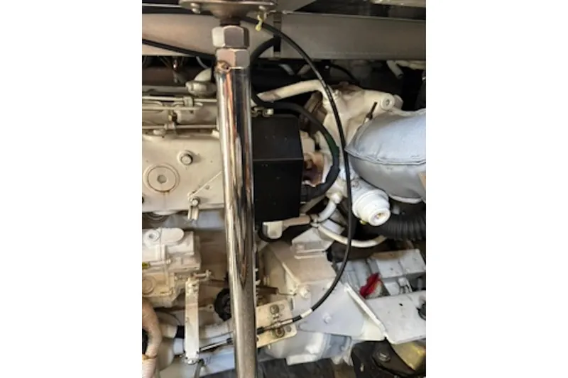 Slide: The Image of Engine compartment of a 2004 Carver 396 Motor Yacht, showcasing mechanical components. - 19