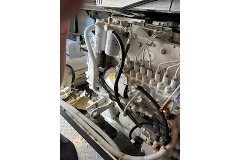 Slide: The Image of Engine compartment of a 2004 Carver 396 Motor Yacht, showcasing mechanical components. - 20