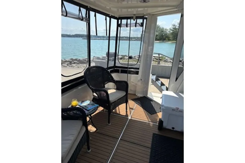 Slide: The Image of Interior of 2004 Carver 396 Motor Yacht with lake view and seating area. - 9