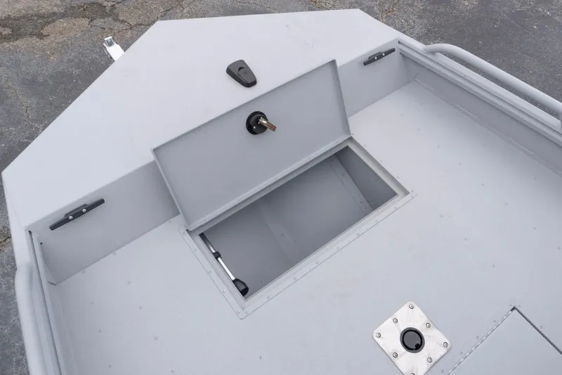 Slide: The Image of 2026 G3 Sportsman 2400 boat deck with storage compartment and latch. - 13