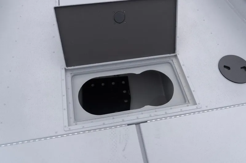 Slide: The Image of Open storage compartment on 2026 G3 Sportsman 2400 boat deck. - 14