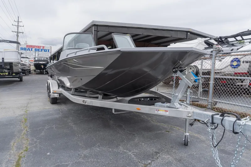 Slide: The Image of 2026 G3 Sportsman 2400 boat on trailer at dealership, ready for sale. - 2