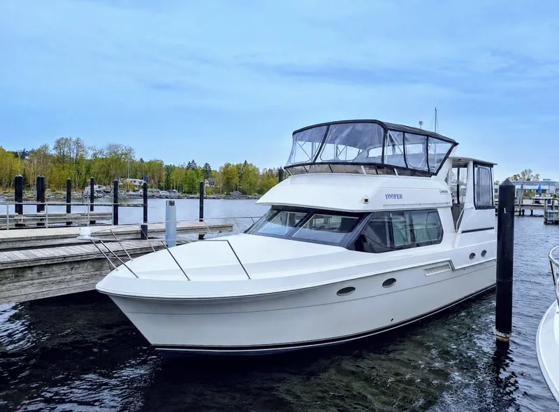 Slide: The Image of 1999 Carver 406 Aft Cabin Motor Yacht docked at marina. - 1