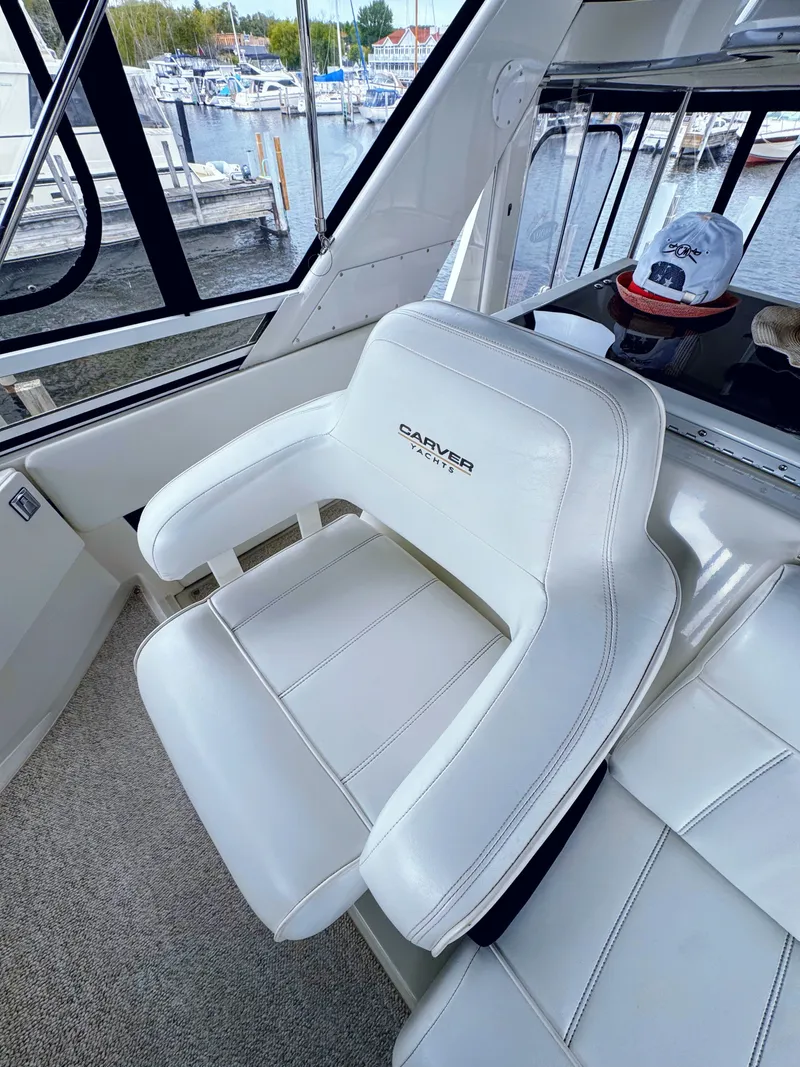 Slide: The Image of Carver 406 Aft Cabin Yacht seat, 1999 model, with marina view. - 18