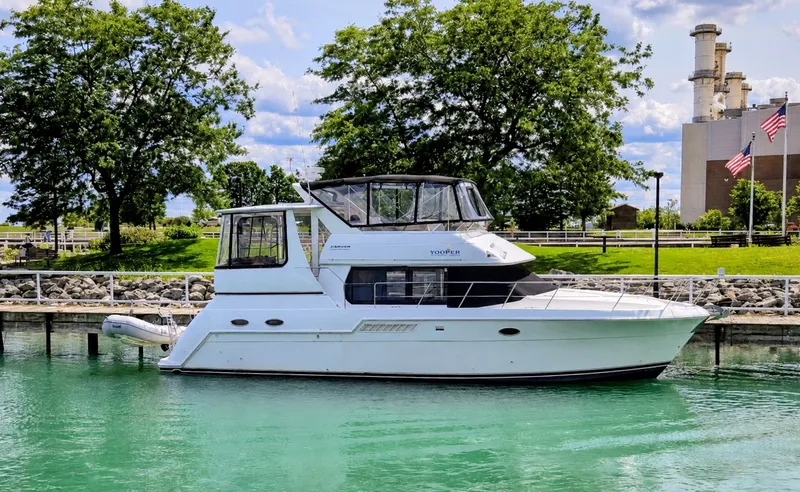 Slide: The Image of 1999 Carver 406 Aft Cabin Motor Yacht docked in harbor. - 2