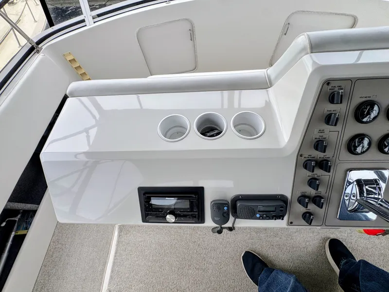 Slide: The Image of 1999 Carver 406 Aft Cabin Yacht helm console. - 20